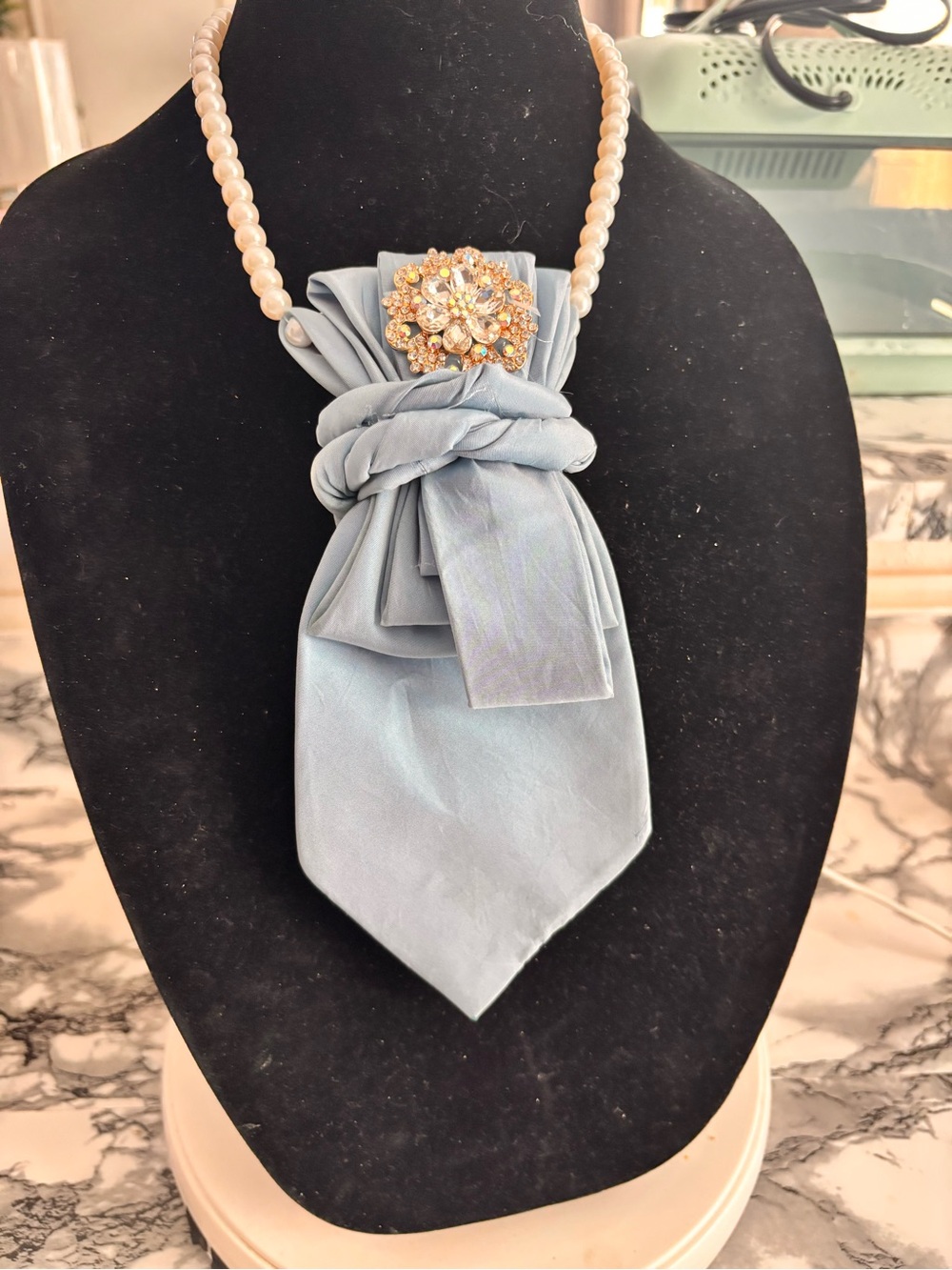 Pearl Strand Necklace with Pale Blue Silk Bow and Crystal Brooch
